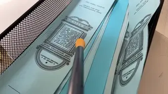 The sensor probe touching paper (paper)