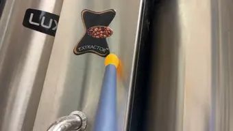 The sensor probe touching coffee machine (steel)